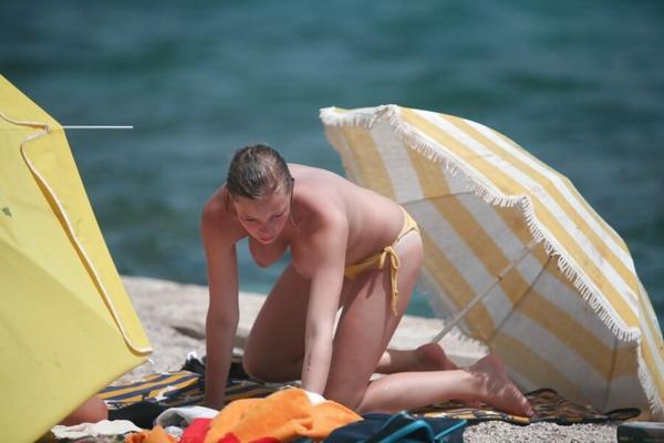 Topless nice boobs in yellow bikini