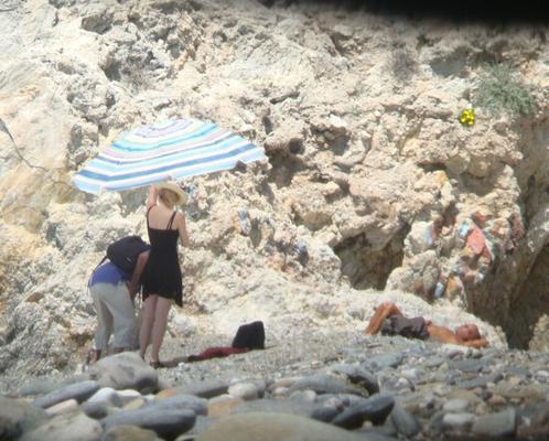 Hot young French girl spied stripping on the beach