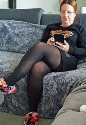 Mature UK brunette MILF has attractive face, curvy body and legs