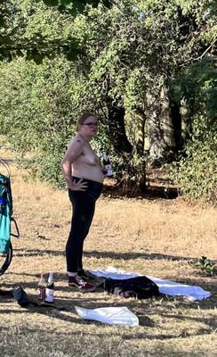 Topless fat slut in public park