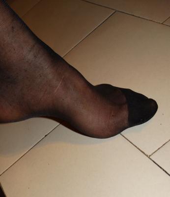 my feet in black nylon socks