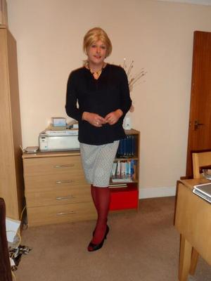 CD Nicola in Black Top, Cream Skirt & Red Tights