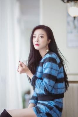 Chinese model in blue sweater dress