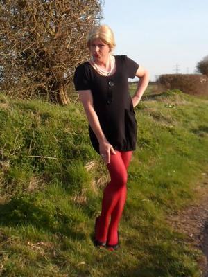 CD Nicola in Black Jumper Dress & Red Tights