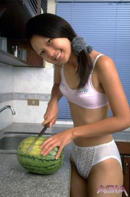 Asian Chrystine a juicy watermelon and a juicy pussy