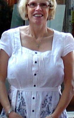 Mature lady fully dressed with big tits