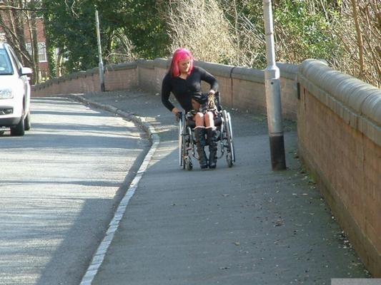 Leah Caprice Flashing in a Wheelchair