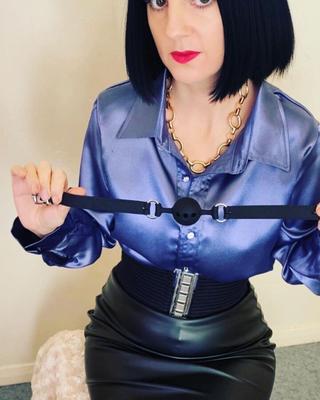 Strict Mistress Emma dressed in Leather and Satin