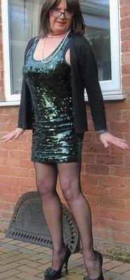 Sissy faggot sally in and out of her sexy green sparkly dress.