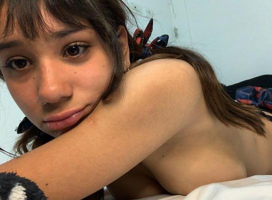 Horny Latina teen shows boobs and feet